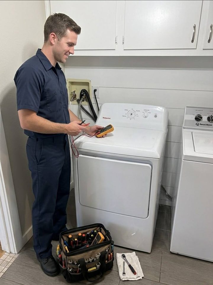 Anchor technician metering a dryer in a Kitsap laundry room